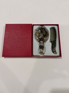 Brand new Vintage Peacock Hand Mirror & Comb Set