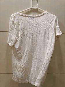 white tee with beeded pocket style