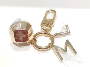 lady million bag charm