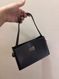 Chic Black Handbag with Gold Chain