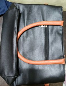 Chic Black Tote Bag with Tassel Accent