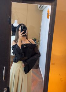 Off-Shoulder Ruffle Black Top with camel skir