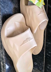 Red Tape Beige unisex Slides.
