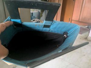 Unique Teal Handbag with Ornate Border