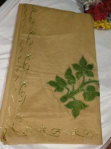 Elegant Beige Saree with Green Floral Embroidery