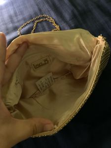 Gold metal mesh clutch