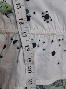 White Sleeveless Top with Floral Print