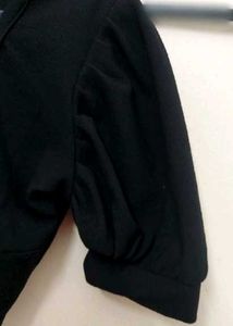 black crop top with bell sleeves