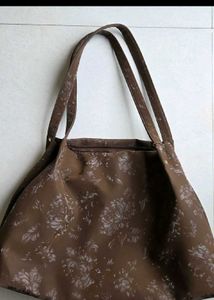 Cute shoulder bag with self color floral print.