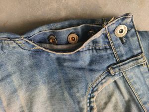 Faded Vintage Replay Jeans with multiple buttons