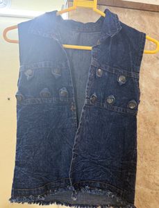 Denim vest with decorative buttons