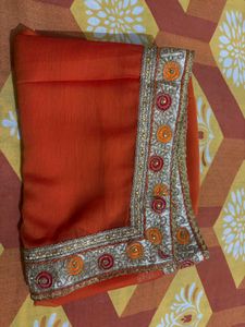 Vibrant Orange Saree with Golden Border
