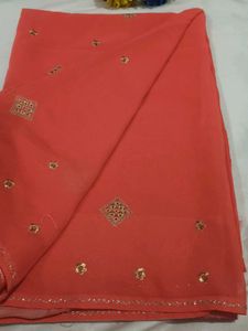 Elegant Orange Saree with Golden Embellishments