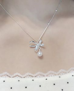 Delicate Bow Pendant Necklace