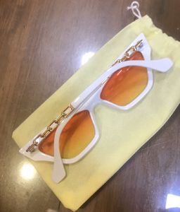 White Cat-Eye Sunglasses with Orange Lenses