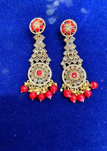 Gold Tone Dangle Earrings with Red Stones