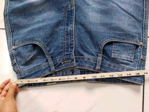Flared Blue Jeans with Button Detail