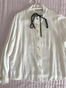 Chic White Blouse with Black Ribbon Detail🤍
