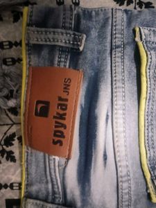 Stylish Blue Denim Jeans with Yellow Accent