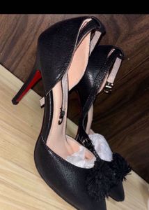 Stylish Black Heels with Pom-Pom Accent