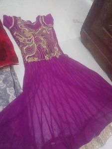 Elegant Purple Gown with Gold Embellishments