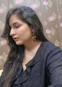 Gold Tone Earrings with reddish stone