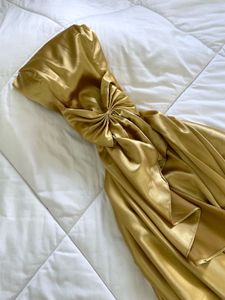 Elegant Gold Strapless Gown with Bow Detail