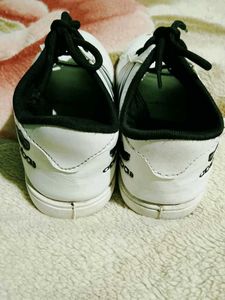 Classic White Sneakers with Black Stripes
