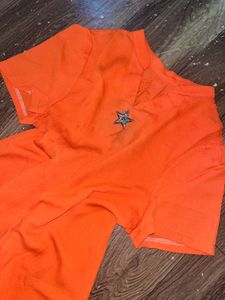 Bright Orange Top with Star Accent