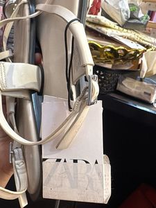 White Flat Sandals with Silver Detail