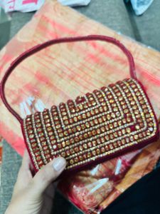 Red Embroidered saree and Blouse with Handbag