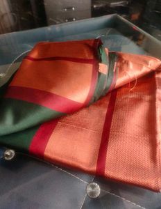 Elegant Green Saree with Red Border