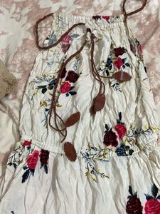 off white jumpsuit with floral touch