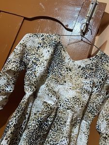 Chic Animal Print Peplum Top