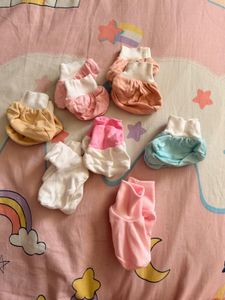 baby mittens,caps, and socks. 7 pairs