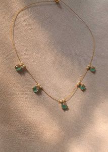 Elegant Gold Necklace with Gemstone Details