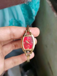 Sonata Gold Tone Red Dial Watch