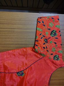 Cream saree with orange blouse