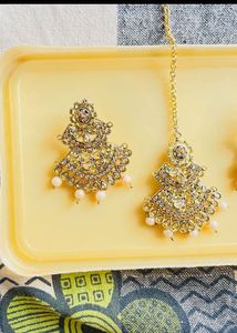 Gold jhumka earrings with maangtikka