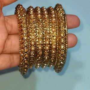 Elegant Gold Bangles with Pearl Embellishments