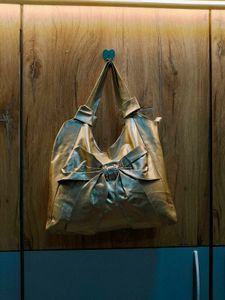 chic gold tote bag with bow accent