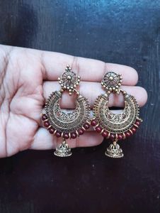 Antique Gold Jhumka Earrings with Red Beads