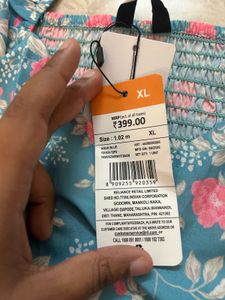 Blue Floral Smocked Peplum Top