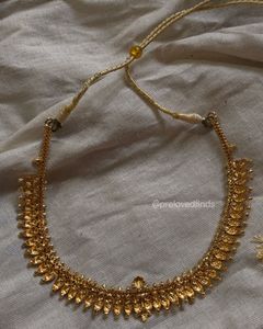 Elegant Gold Tone Necklace with Tassel