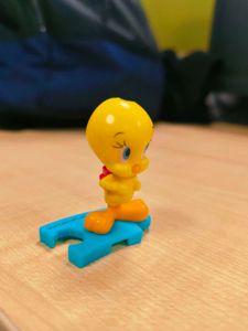 Cute Tweety Bird Toy Figure holding pink bag pack,