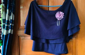 Elegant Navy Blue Tiered Blouse with Flower Accent