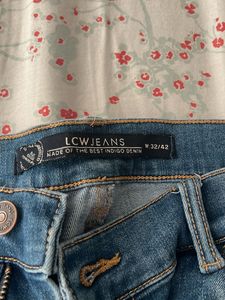 Distressed Blue Denim Jeans