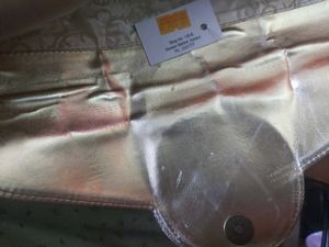 Beautiful golden Clutch with a bronze buckle