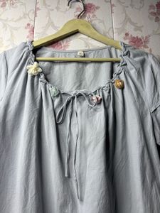 Chic Grey Blouse with Floral Embellishments