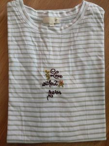 stripped off white top with thread embroidery